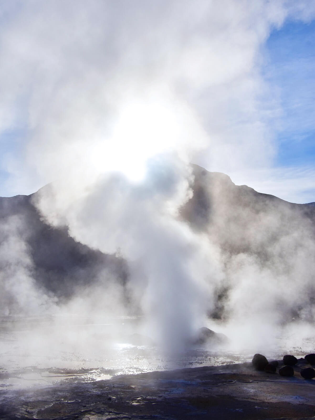 Sun Crests as Geyser Blows