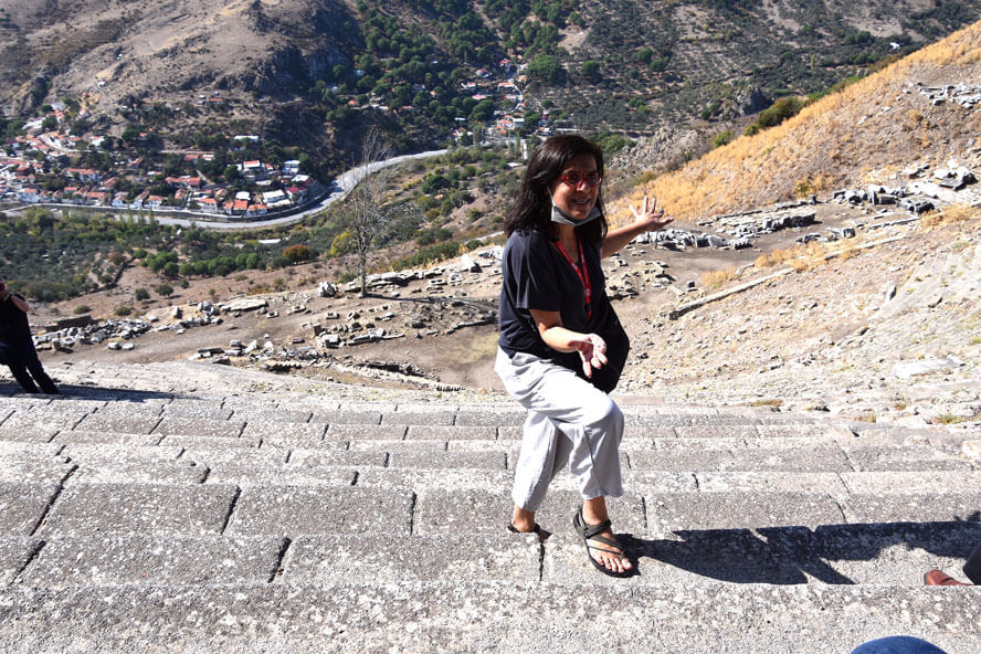 Yasemin at the Top of the Theatre of Pergamon. Pergamon – Visiting Turkey’s Roman Stronghold.