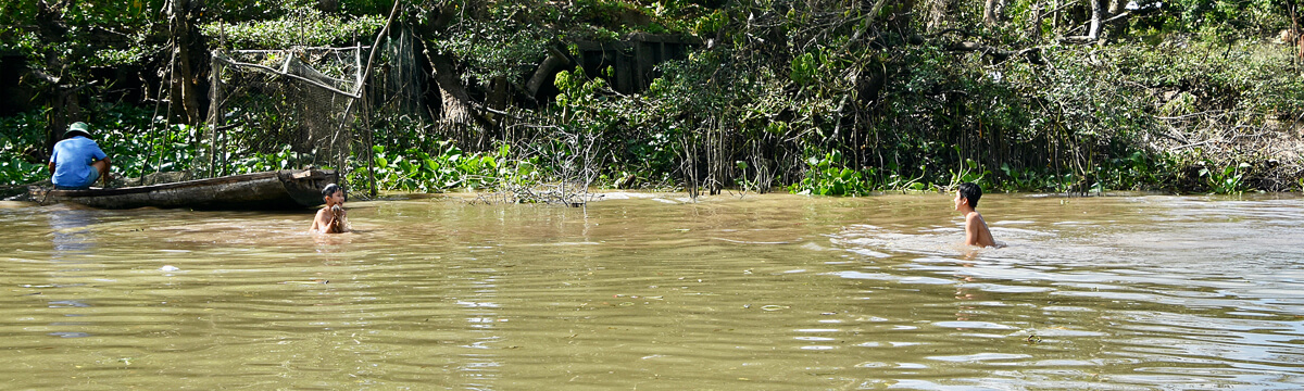 Boys Playing in the River