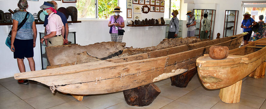 Alison Examining Canoes at the Sea Museum of Hane