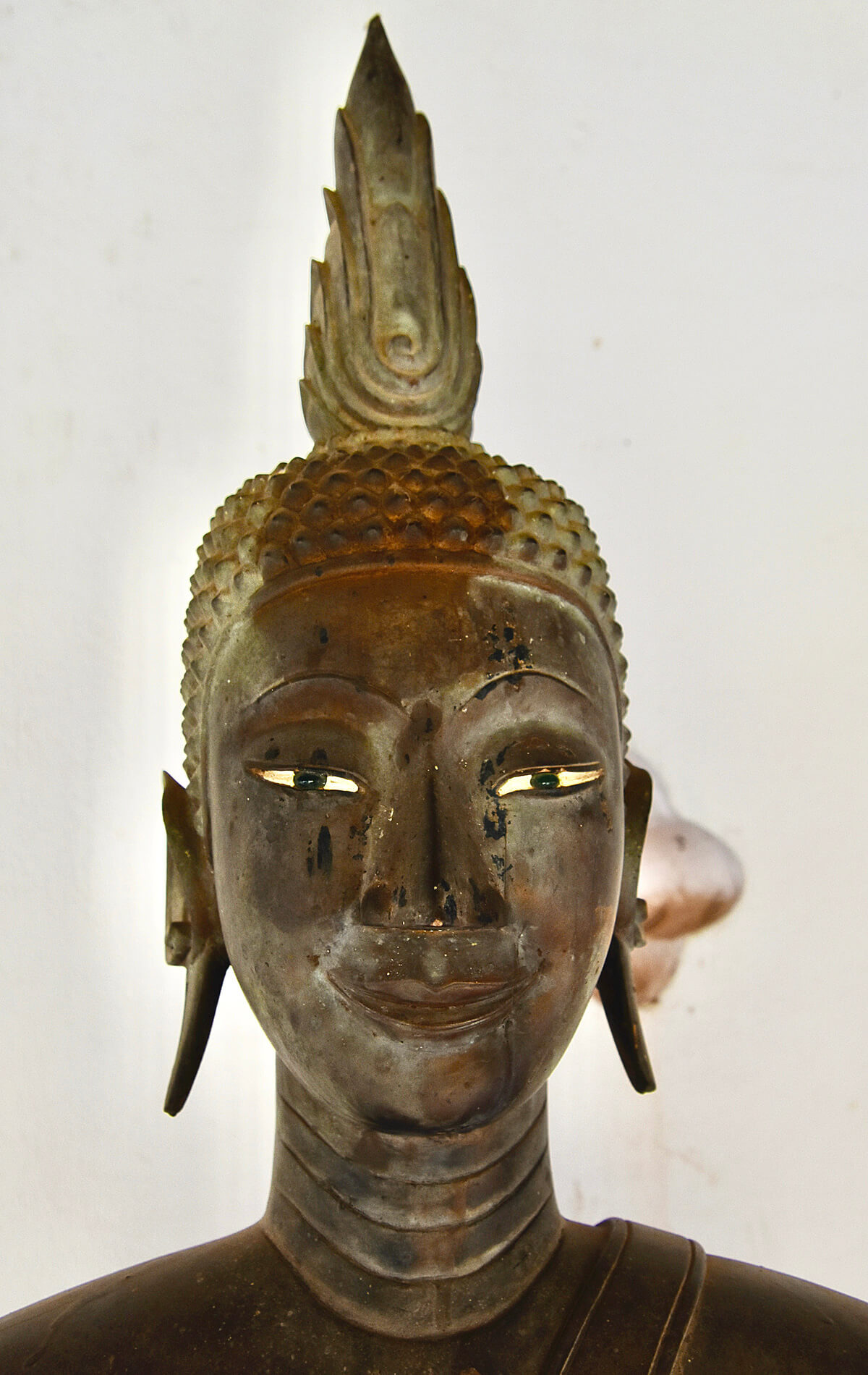 Head of a Buddha in the Great Stupa Courtyard