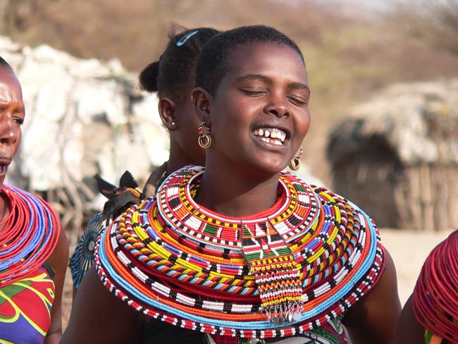 Local woman displaying traditional bead work | Location: Kenya