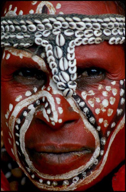 Local Man with painted face at the Festival of Indepence | Location: Papua New Guinea